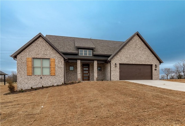 view of front of house featuring a garage and a front yard