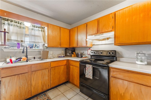 kitchen featuring sink, black / electric stove, and light tile patterned flooring