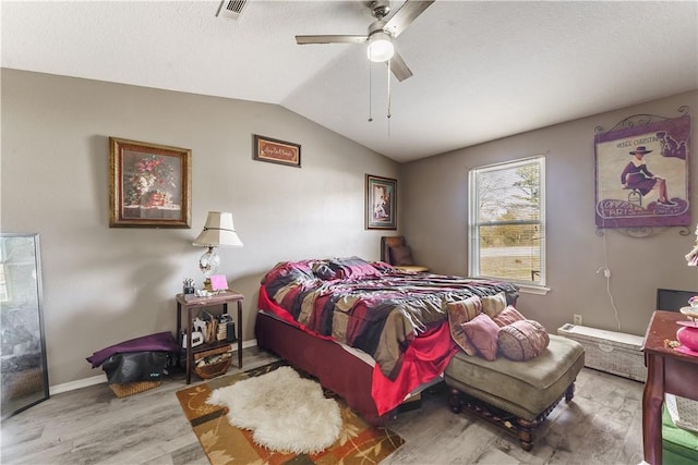 bedroom featuring wood-type flooring, lofted ceiling, and ceiling fan