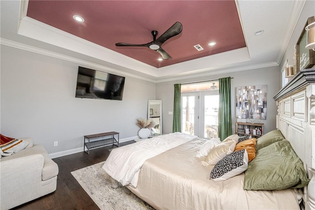 bedroom with ceiling fan, ornamental molding, dark hardwood / wood-style floors, and a raised ceiling