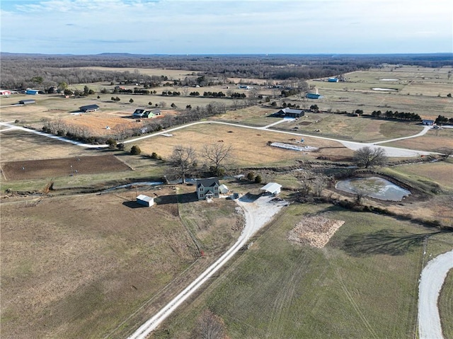 birds eye view of property featuring a rural view