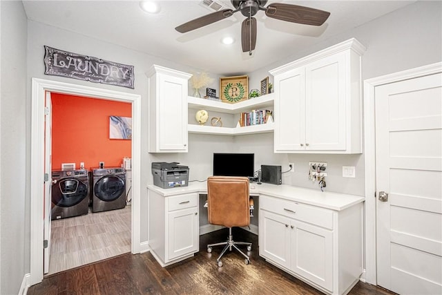 office featuring separate washer and dryer, built in desk, dark hardwood / wood-style floors, and ceiling fan