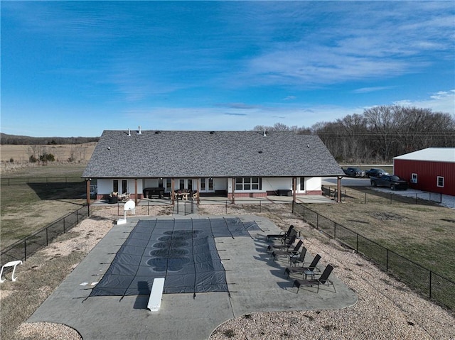 back of property featuring a patio and a yard