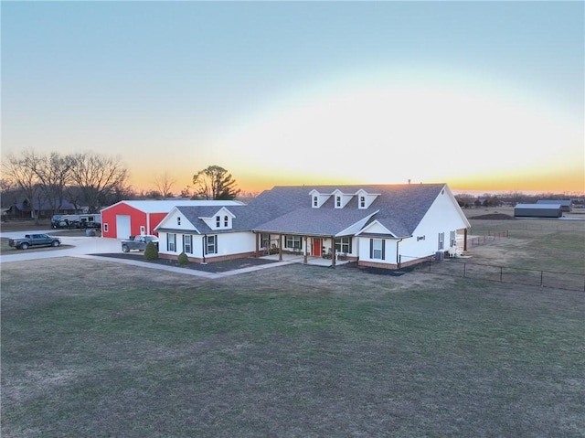 view of front facade with a garage and a yard