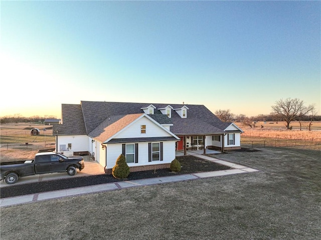 view of front of house featuring a lawn