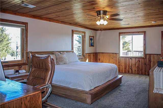 carpeted bedroom featuring wood ceiling and ceiling fan