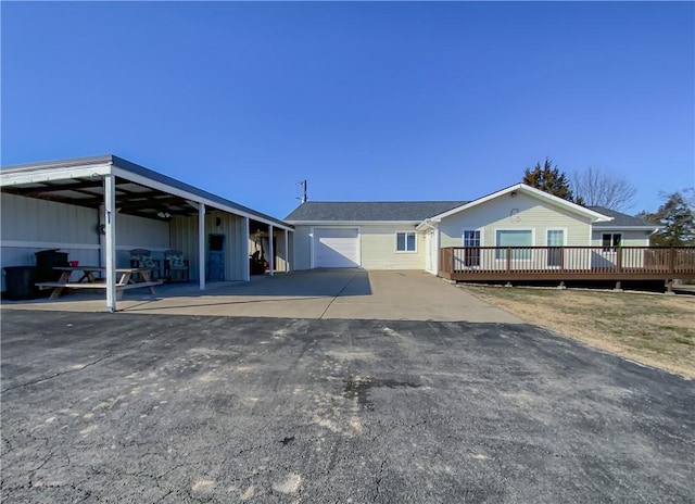 view of front of property featuring a carport and a deck