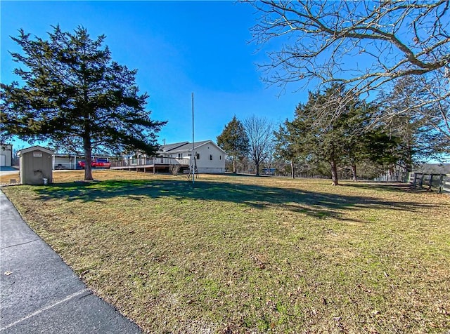 view of yard with a wooden deck