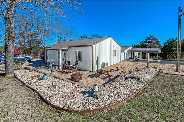 view of side of property with a carport