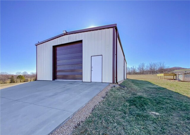 garage featuring a yard