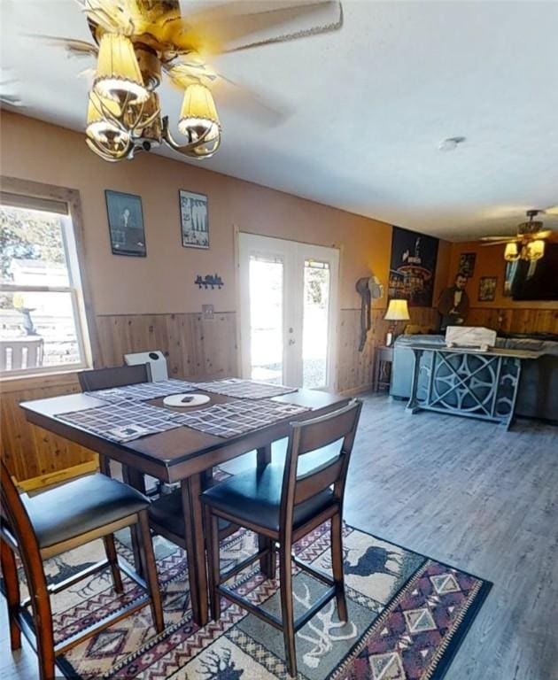 dining room featuring hardwood / wood-style floors, a wealth of natural light, french doors, and ceiling fan