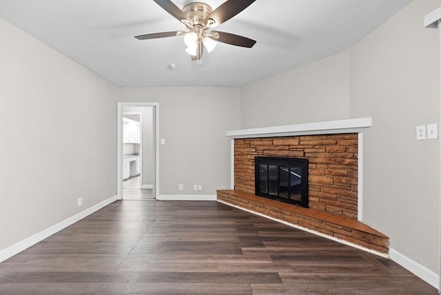 unfurnished living room featuring dark hardwood / wood-style floors and ceiling fan