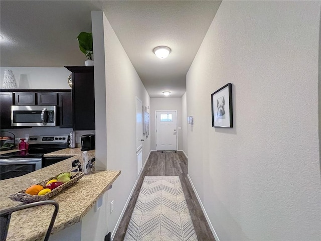 hall with dark hardwood / wood-style flooring