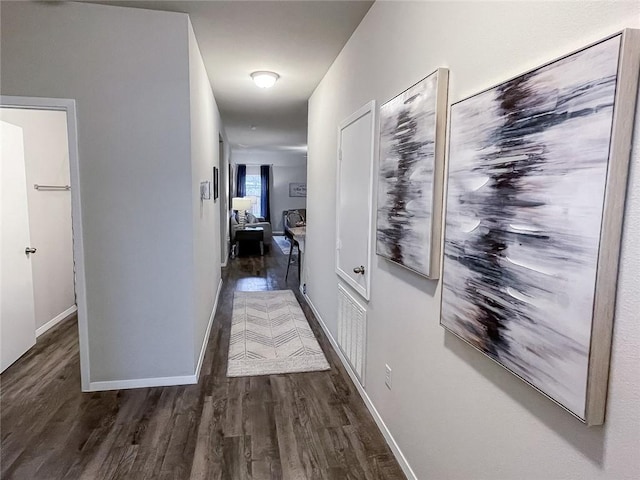 hall with dark hardwood / wood-style floors