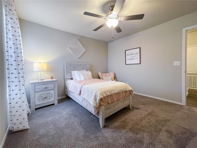 bedroom with ceiling fan and dark carpet