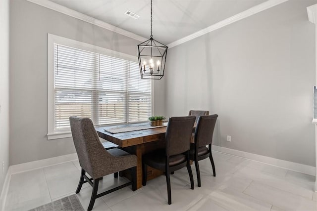 dining space with light tile patterned floors, a chandelier, ornamental molding, and plenty of natural light