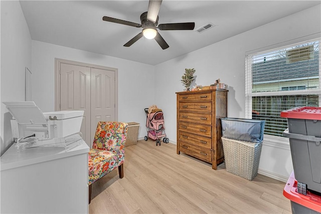 interior space featuring light hardwood / wood-style floors and ceiling fan