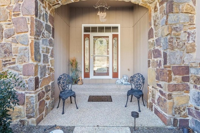 doorway to property with stone siding