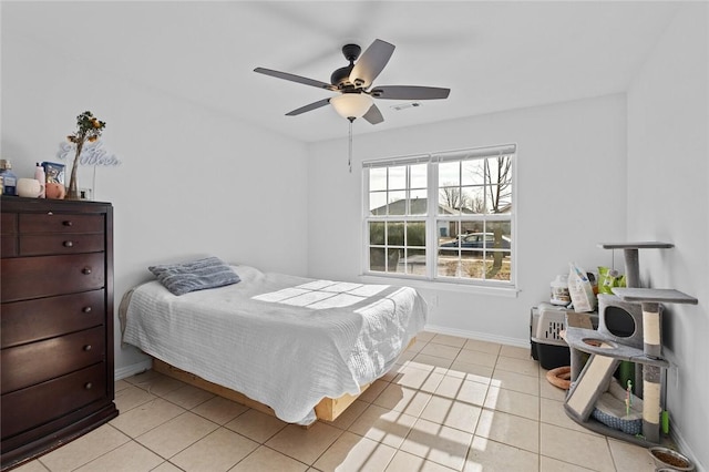 tiled bedroom with ceiling fan