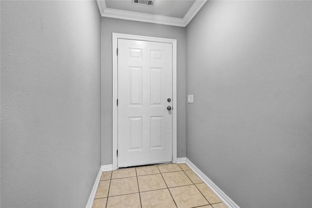 doorway to outside featuring light tile patterned floors and crown molding