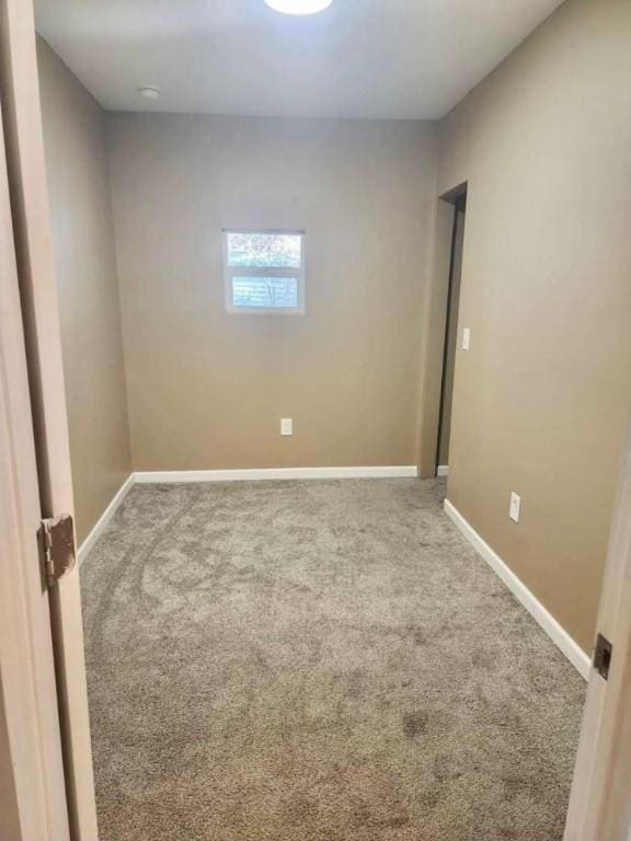 unfurnished room featuring carpet floors