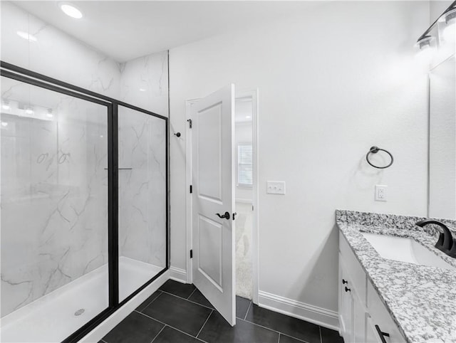 bathroom with vanity, an enclosed shower, and tile patterned flooring