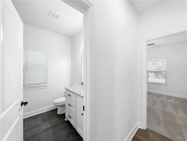 bathroom with vanity and toilet