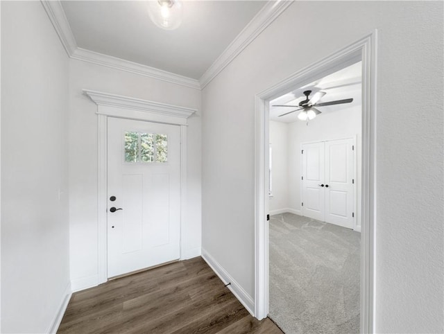 entrance foyer with crown molding, ceiling fan, and dark hardwood / wood-style floors