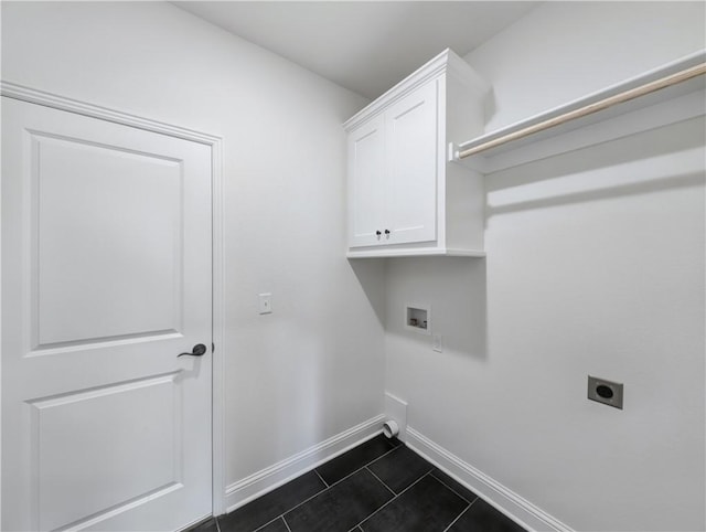 washroom with cabinets, washer hookup, dark tile patterned floors, and hookup for an electric dryer