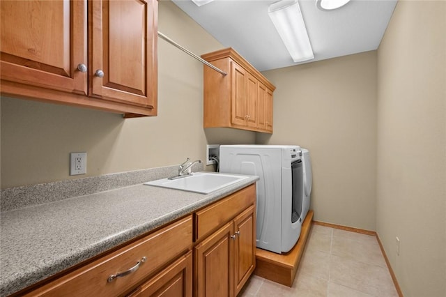 washroom featuring hookup for a washing machine, light tile patterned flooring, sink, and cabinets