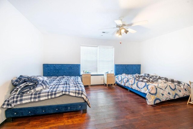 bedroom featuring dark wood-type flooring and ceiling fan