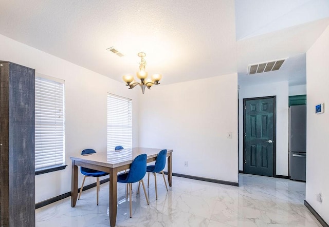 dining room with a chandelier