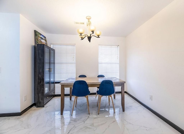 dining room featuring a chandelier