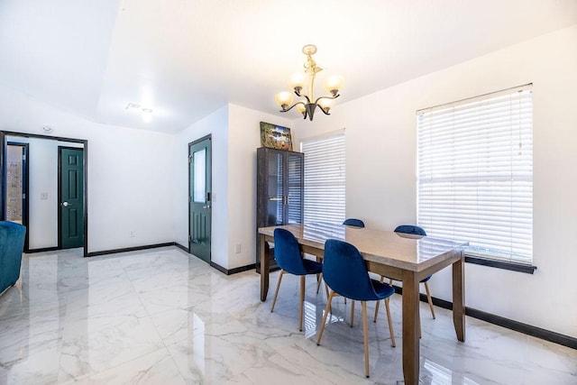 dining space featuring a chandelier