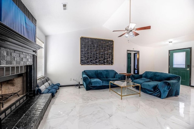 living room with a brick fireplace, lofted ceiling, and ceiling fan