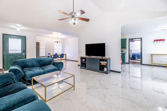 living room featuring ceiling fan with notable chandelier and high vaulted ceiling