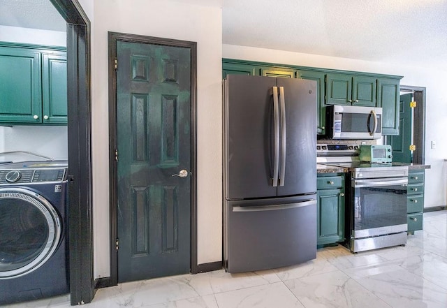 kitchen with washer / dryer and appliances with stainless steel finishes