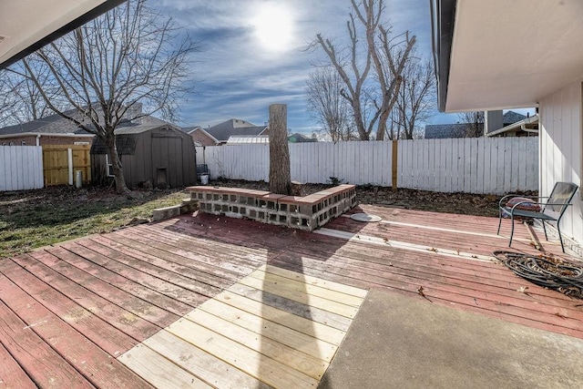 wooden deck featuring a storage unit