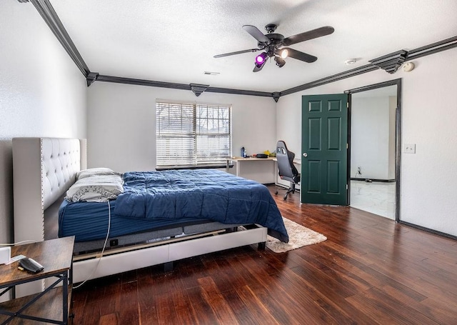 bedroom featuring hardwood / wood-style flooring, ceiling fan, crown molding, and a textured ceiling