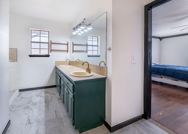 bathroom featuring vanity and a textured ceiling