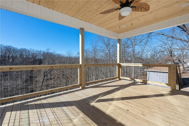 wooden deck featuring ceiling fan