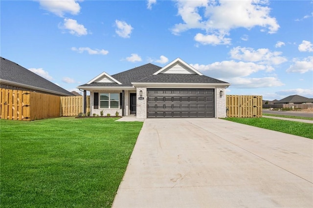 single story home with a garage and a front lawn