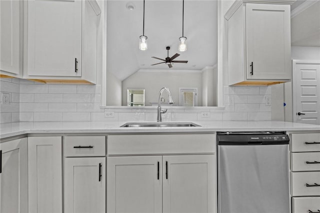 kitchen featuring sink, crown molding, dishwasher, white cabinetry, and decorative light fixtures