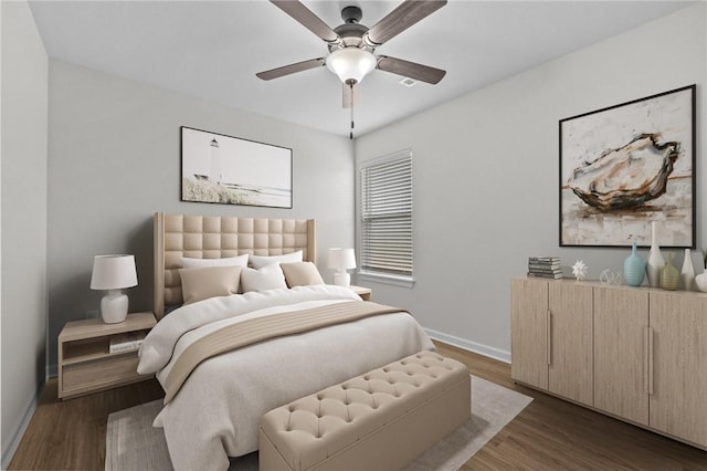 bedroom with ceiling fan and dark hardwood / wood-style floors