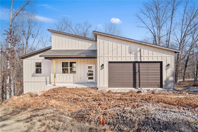 view of front facade with a garage and covered porch