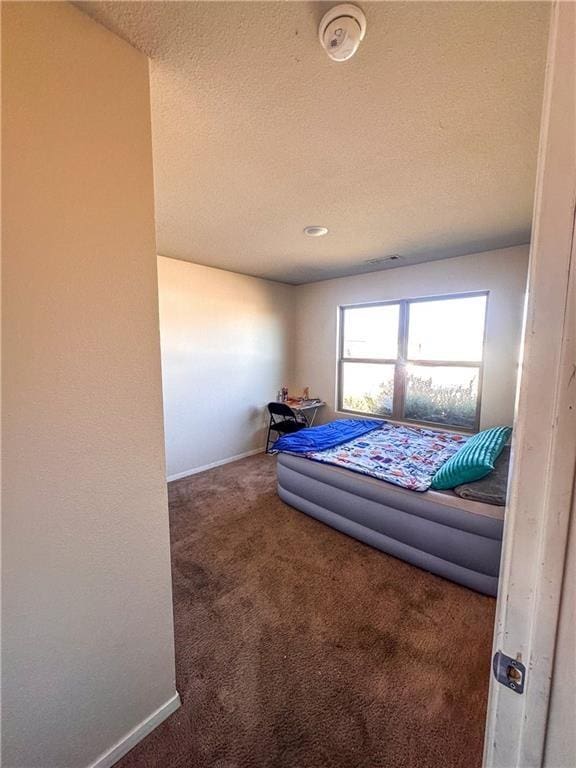 bedroom featuring carpet