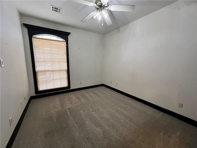 empty room with carpet floors and ceiling fan