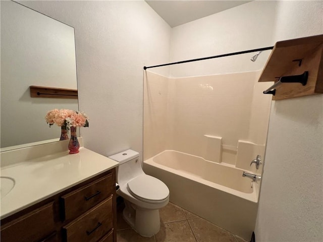 full bathroom featuring washtub / shower combination, vanity, toilet, and tile patterned floors