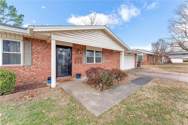 view of front of home with a garage and a front lawn