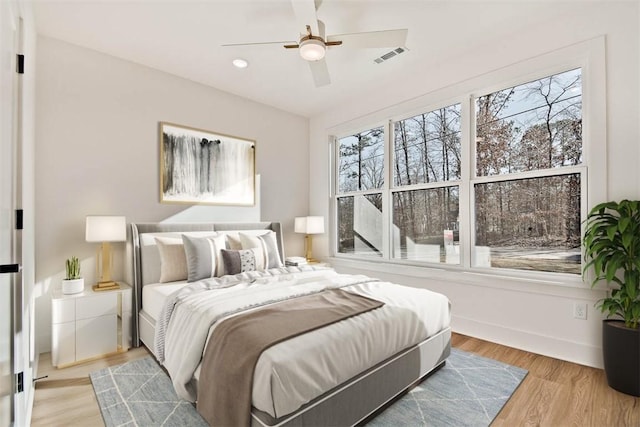 bedroom featuring ceiling fan and light hardwood / wood-style floors